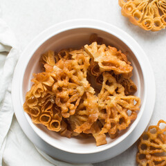 Overhead view of sassafa northern nigerian snack, top view of rosette cookies on a countertop	