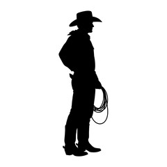 Silhouette of a cowboy standing with a lasso in hand wearing a hat and boots in a western setting image