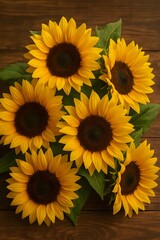 Obraz premium Top view of a vibrant bouquet of blooming sunflowers with bright yellow petals and dark centers arranged on rustic wooden background, symbolizing summer, nature, and positivity
