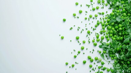 Fresh peas and green leaves scattered on a white background.
