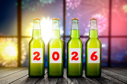 Four bottles of beer with the number 2026 on the labels, celebrating New Year's Eve.