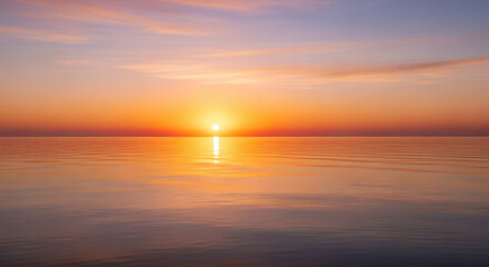 Obraz premium Colorful sunset over the sea with soft clouds and reflection of sunlight on water
