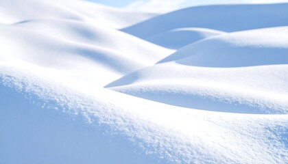 Obraz premium Pristine Snowy Landscape: Soft, White Hills Under a Clear Blue Sky