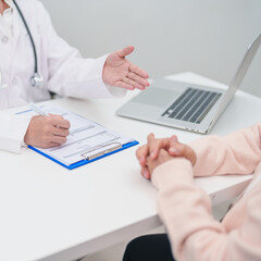Fototapeta premium Doctor explaining diagnosis and treatment plan to elderly patient during hospital appointment. Senior patient talking doctor to disease. medical consulting, geriatric care, healthcare concept