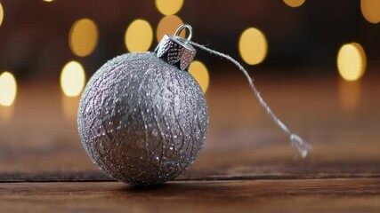 Festive Silver Ornament on Wooden Surface, Holiday Decoration Close-up - Powered by Adobe