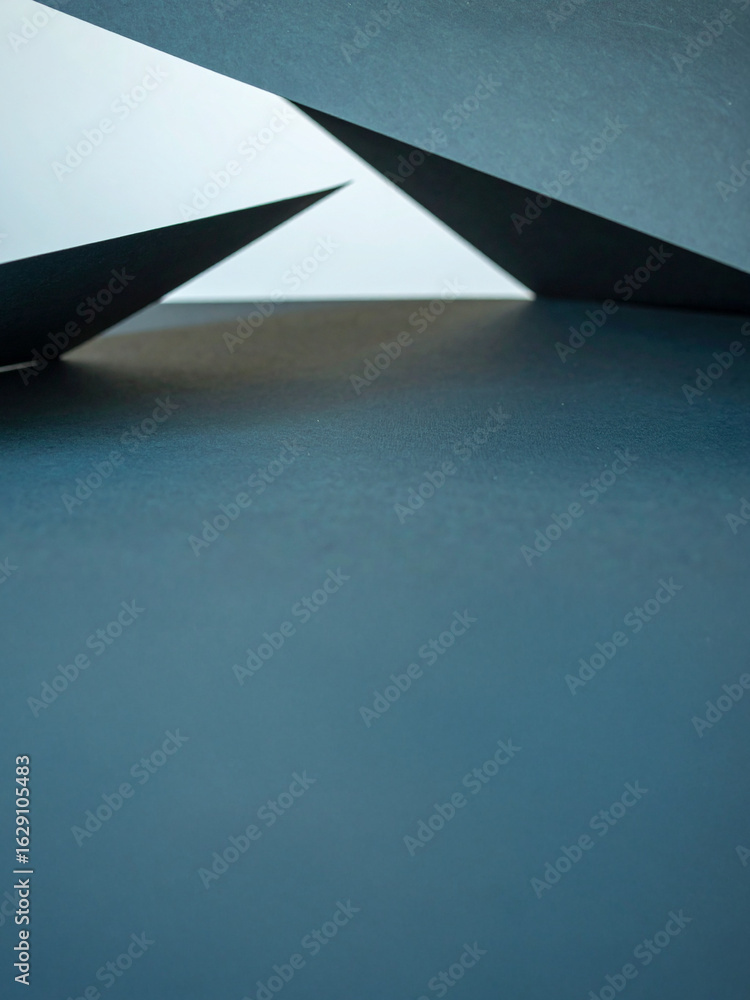 Poster a striking abstract composition of overlapping geometric triangles in a minimalist style. the deep b