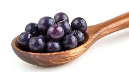Fototapeta premium Spoonful of Fresh Muscadine Grapes Displaying Dew Drops on Purple Skin, Studio Shot