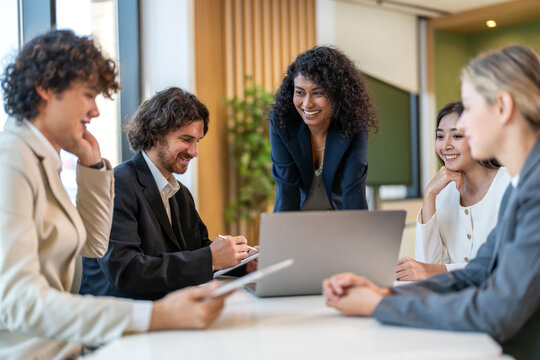 Leadership training, executive communication and team development in progress with diverse professionals in coaching seminar, strategic thinking and interpersonal skills in a modern workplace