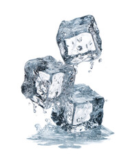 Three melting ice cubes on a surface with water droplets.