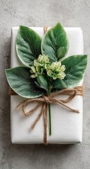 White gift box with greenery