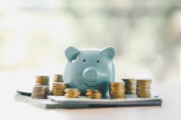 Money box filled with coins, saving cash, banking wisely, making sound investments can build...