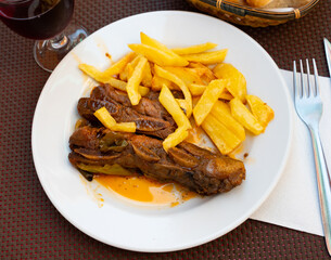 Traditional Spanish dish is Churasco, made from roast beef. Served with French fries and stewed peppers