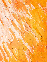 This vibrant abstract image showcases a dynamic interplay of orange and white streaks and textures.