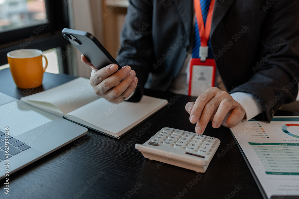 Poster a businessman woks with a foreign company and uses a smartphone to help send and receive information