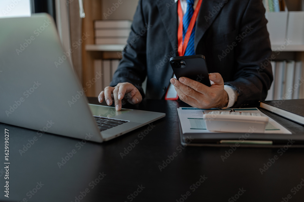 Poster a businessman woks with a foreign company and uses a smartphone to help send and receive information