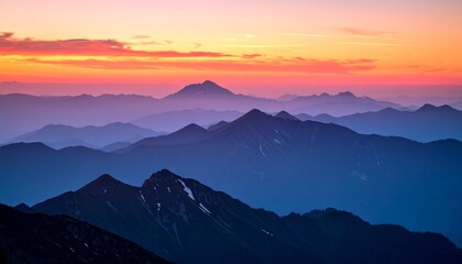 Fototapeta premium Majestic Mountain Silhouette at Sunset Serene Landscape with Vibrant Orange and Blue Skies.