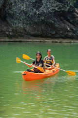 Asian Women Canoeing on Oyo River in Yogyakarta Nature Escape