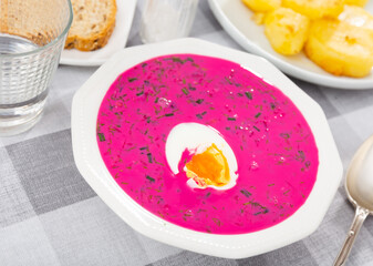 Popular dish of Belarusian cuisine is the summer vegetable soup Kholodnik, prepared on the basis of beetroot and decorated ..with sliced boiled egg on top