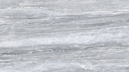 The surface features a stunning gray marble with beautiful waves and intricate patterns. The smooth stone reflects light beautifully, perfect for interior design or architecture.