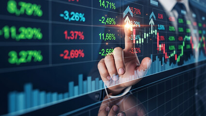 Hand touches screen displaying stock market data with charts and percentage changes.