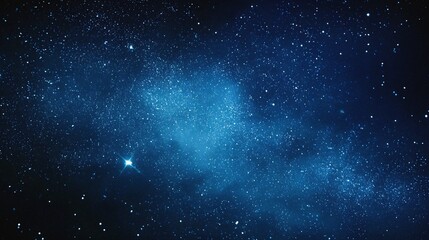 Fototapeta premium Starry sky background, blue night sky full of stars, glowing stars in the dark space, starry background, dark night, stars in the distance, starlight, dark background with a blue glow, night sky. 