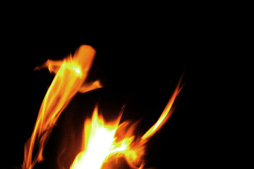 Close up burning flames on black background for graphic design or wallpaper.
