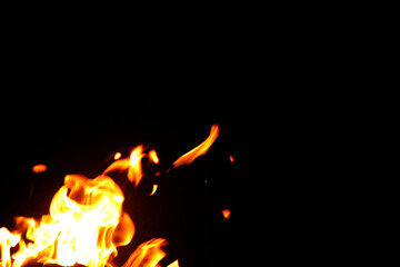 Close up burning flames on black background for graphic design or wallpaper.