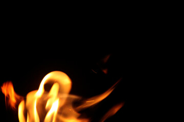 Close up burning flames on black background for graphic design or wallpaper.