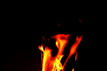 Close up burning flames on black background for graphic design or wallpaper.