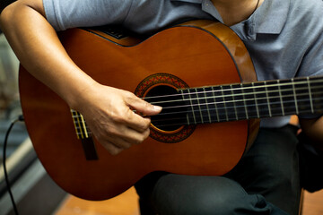 Close-Up of Hand Playing Classical Guitar Chord