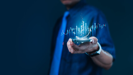 Businessman holding smartphone with upward financial chart for mobile stock trading and growth analytics on fintech platforms