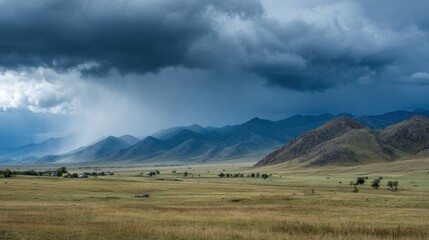Obraz premium Dark, ominous storm clouds loom over the vast grasslands of Mongolia, creating a dramatic contrast with the distant mountains. Rain begins to fall in the background, suggesting a brewing storm.
