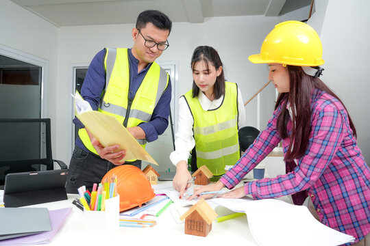 Engineer young asian new project meeting. Teamwork people engineer consultant brainstorm. Architect engineer planning project construction site office concept. - Powered by Adobe