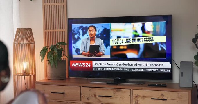 Screen, person and watching tv with breaking news, broadcast and increase in gender based violence. Television display, home and woman listen to info for crime rate, headline and report in lounge