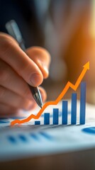 Hand analyzing financial documents with rising bar and line chart, symbolizing business growth, success, financial planning, investment strategy, and increasing performance metrics.

