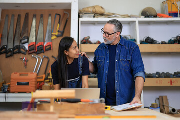 young african american male carpenter worker hold wooden plank at the carpentry workshop	
