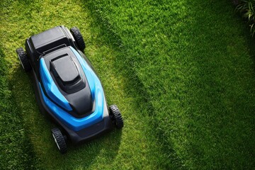 Sleek Blue Robotic Lawnmower on a Lush, Perfectly Manicured Green Lawn from Above