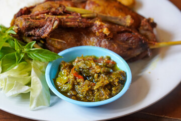 Duck Rice with Green Chili Sambal, Indonesia, captured on August 6, 2025. Steamed rice served with crispy fried duck and a spicy green chili sambal, a bold and flavorful Indonesian specialty
