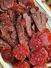 Sliced raw smoked sausage