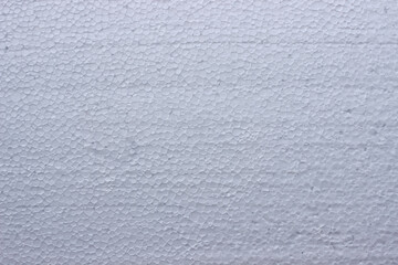 White polystyrene foam texture background, styrofoam uniform geometric surface ideal for packaging, insulation, and material design visuals