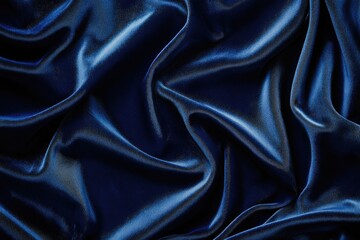 Obraz premium Deep blue fabric with rich, flowing folds and subtle sheen, exhibiting luxurious texture and dramatic drapery