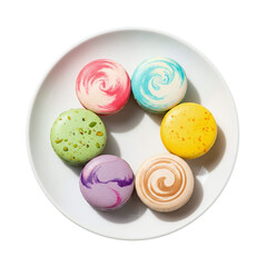 Colorful french macarons on a white plate