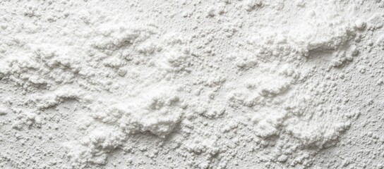 Close-up of a textured, off-white powder, showing a rough, uneven surface with peaks and valleys