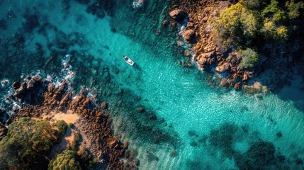 Tableau sur plexiglas  Aerial view of the coastline, crystal clear water, underwater rocks, and a golden beach. Beautiful and attractive natural scenery.  © Nurma