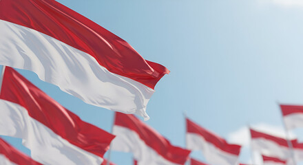 Vibrant Collection of Indonesian Flags Waving in the Breeze Against a Clear Sky During Independence Day Celebration