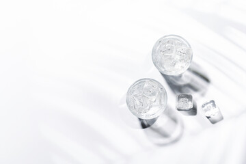 Crystal-clear glasses filled with chilled water and ice cubes