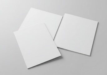 A graphic design template showing blank white brochures, with one open to reveal the inside.

