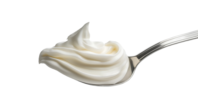 Creamy liquid splashing from a spoon, creating a dynamic, elegant swirl.