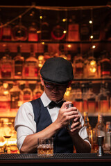 Bartender is pouring whiskey into a glass in a restaurant