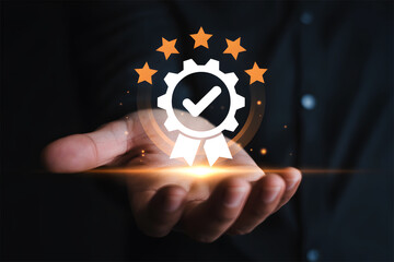 Quality assurance concept. Hand holding a sign of top service with a five-star rating and seal.